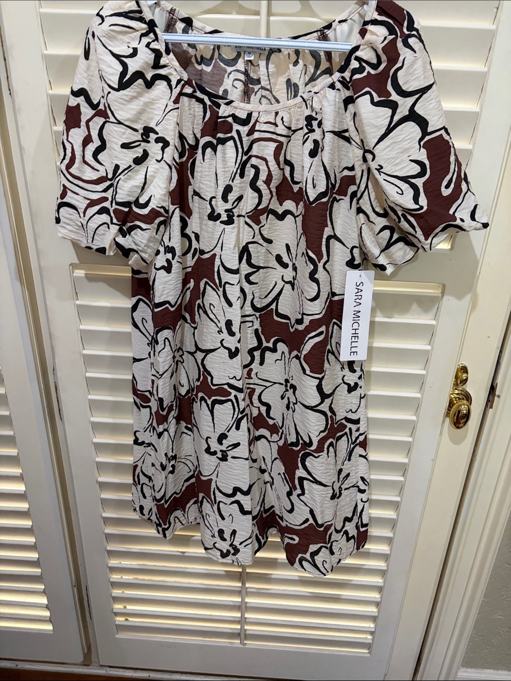 Sara Michelle Cream Dress with Black and Brown Abstract Motif. Size small. NWT